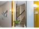 Entryway with gold accents, mirror, and modern wall sconces at 1692 Tropical Palms Cir, Kissimmee, FL 34747