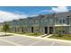Modern townhouses with gray siding and stone accents at 1692 Tropical Palms Cir, Kissimmee, FL 34747