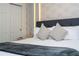Main bedroom with plush bedding and elegant decor at 1692 Tropical Palms Cir, Kissimmee, FL 34747