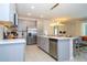Modern kitchen with stainless steel appliances and gray cabinets at 1692 Tropical Palms Cir, Kissimmee, FL 34747