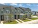 Modern townhouses with gray siding and stone accents at 1692 Tropical Palms Cir, Kissimmee, FL 34747