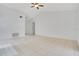 Open living room with tile floors and vaulted ceilings at 1121 Trotwood Blvd, Winter Springs, FL 32708