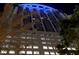 Night view of a modern high-rise building at 155 S Court Ave # 1610, Orlando, FL 32801