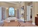 Luxurious bathroom with soaking tub and tiled floors at 9400 Laws Rd, Clermont, FL 34714