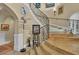 Elegant curved staircase with ornate railing and decorative accents at 9400 Laws Rd, Clermont, FL 34714