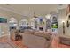 Open living room with hardwood floors and ample seating at 9400 Laws Rd, Clermont, FL 34714