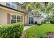 Townhouse exterior showcasing landscaping and patio at 10747 Belfry Cir, Orlando, FL 32832