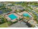 Community pool with a playground, lounge chairs, and ample parking at 10747 Belfry Cir, Orlando, FL 32832