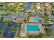 Community pool with a playground, lounge chairs, and ample parking at 10747 Belfry Cir, Orlando, FL 32832