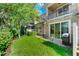 Private patio and backyard with lush landscaping at 10747 Belfry Cir, Orlando, FL 32832