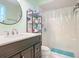Bathroom with vanity, shower/tub combo, and shelving unit at 36 Mayfield Cir, Ormond Beach, FL 32174