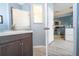 Bathroom with vanity and view into kitchen at 3004 White Orchid Rd, Kissimmee, FL 34747