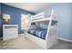 Bedroom with a white bunk bed and blue walls at 3004 White Orchid Rd, Kissimmee, FL 34747
