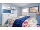 Bedroom with queen bed, dresser, and window at 3004 White Orchid Rd, Kissimmee, FL 34747