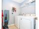 Laundry room with washer, dryer, and shelving at 3004 White Orchid Rd, Kissimmee, FL 34747