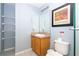 Small bathroom with wood vanity and wire shelving at 3004 White Orchid Rd, Kissimmee, FL 34747