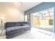 Living room with L-shaped sofa and view of private pool at 3004 White Orchid Rd, Kissimmee, FL 34747