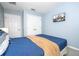 Bedroom with double doors and a mounted TV at 3004 White Orchid Rd, Kissimmee, FL 34747