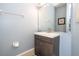 Clean bathroom with vanity, mirror and tiled floor at 3004 White Orchid Rd, Kissimmee, FL 34747