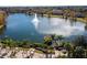 Serene lake view with gazebo and seating area at 3004 White Orchid Rd, Kissimmee, FL 34747