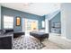 Living room with gray sectional sofa and access to a private pool at 3004 White Orchid Rd, Kissimmee, FL 34747