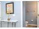 Small half bathroom with toilet and decorative wall art at 3004 White Orchid Rd, Kissimmee, FL 34747