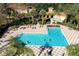 Community pool with plenty of space for swimming and relaxing at 3004 White Orchid Rd, Kissimmee, FL 34747