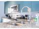 Granite countertop kitchen with modern stainless steel appliances at 3004 White Orchid Rd, Kissimmee, FL 34747