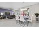 Open concept dining area with modern table and seating at 1585 Mulligan Blvd, Davenport, FL 33896