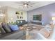 Open living room featuring a TV and accent wall at 1585 Mulligan Blvd, Davenport, FL 33896