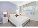Relaxing bedroom with plush bedding and window coverings at 1585 Mulligan Blvd, Davenport, FL 33896