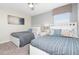 Guest bedroom with two twin beds and neutral decor at 1585 Mulligan Blvd, Davenport, FL 33896
