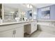 Elegant bathroom featuring double vanity and soaking tub at 1585 Mulligan Blvd, Davenport, FL 33896