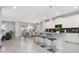 Modern kitchen with white cabinets and an island at 1585 Mulligan Blvd, Davenport, FL 33896