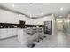 Stylish kitchen boasts white cabinetry and breakfast bar at 1585 Mulligan Blvd, Davenport, FL 33896