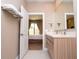 Modern bathroom with double vanity and walk-in shower at 7487 Brooklyn Dr, Kissimmee, FL 34747