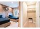 Twin bedroom with an adjacent closet and wood-paneled wall at 7487 Brooklyn Dr, Kissimmee, FL 34747