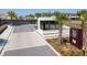 Community entrance with guardhouse and landscaping at 7487 Brooklyn Dr, Kissimmee, FL 34747