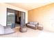 Relaxing patio with wicker furniture and access to the interior at 7487 Brooklyn Dr, Kissimmee, FL 34747