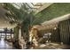 Elegant lobby with a green wall, modern decor and seating at 7487 Brooklyn Dr, Kissimmee, FL 34747