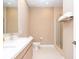 Clean bathroom with double vanity, toilet and shower at 7487 Brooklyn Dr, Kissimmee, FL 34747