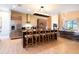 Modern kitchen with island, stainless steel appliances, and wood cabinets at 7487 Brooklyn Dr, Kissimmee, FL 34747