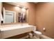 Stylish bathroom with floating vanity and large mirror at 7487 Brooklyn Dr, Kissimmee, FL 34747