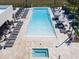 Resort-style pool with a spa and plenty of lounge chairs at 7487 Brooklyn Dr, Kissimmee, FL 34747
