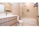 Clean bathroom with shower/tub combo, modern vanity, and neutral tile at 7487 Brooklyn Dr, Kissimmee, FL 34747