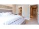 Main bedroom with a plush bed, and an ensuite bathroom at 7487 Brooklyn Dr, Kissimmee, FL 34747