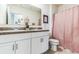 Clean bathroom with double vanity and shower/tub combo at 1839 Wild Rye Way, Kissimmee, FL 34744