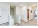 Upstairs hallway with access to bedrooms and bathroom at 1839 Wild Rye Way, Kissimmee, FL 34744