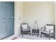Front porch with seating area and welcome sign at 1839 Wild Rye Way, Kissimmee, FL 34744