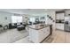 Open concept kitchen with island and living room view at 1839 Wild Rye Way, Kissimmee, FL 34744